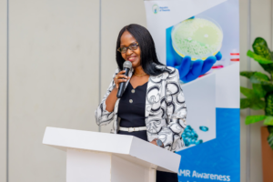 Healthcare workers analyzing laboratory samples related to antimicrobial resistance in Rwanda.