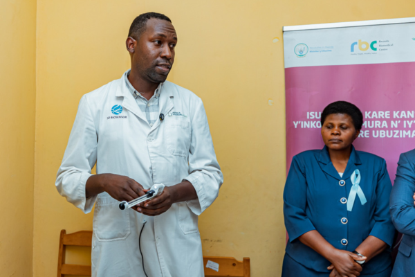 A health worker conducting cervical cancer screening for women at a Rwandan health center.