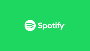 Spotify logo displayed on a screen as the company announces a $10 billion investment in podcast and creator monetization.