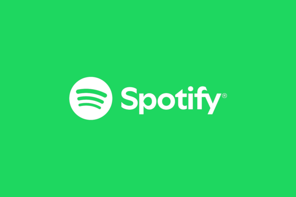 Spotify logo displayed on a screen as the company announces a $10 billion investment in podcast and creator monetization.