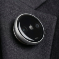 AI Pin wearable device attached to clothing, designed as a screenless alternative to smartphones