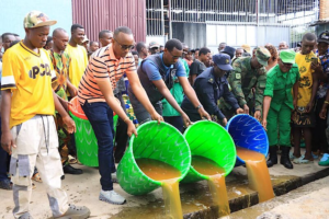 Health officials and police in Rwanda inspect seized illegal alcohol after 28 deaths and 229 hospitalizations linked to methanol poisoning.